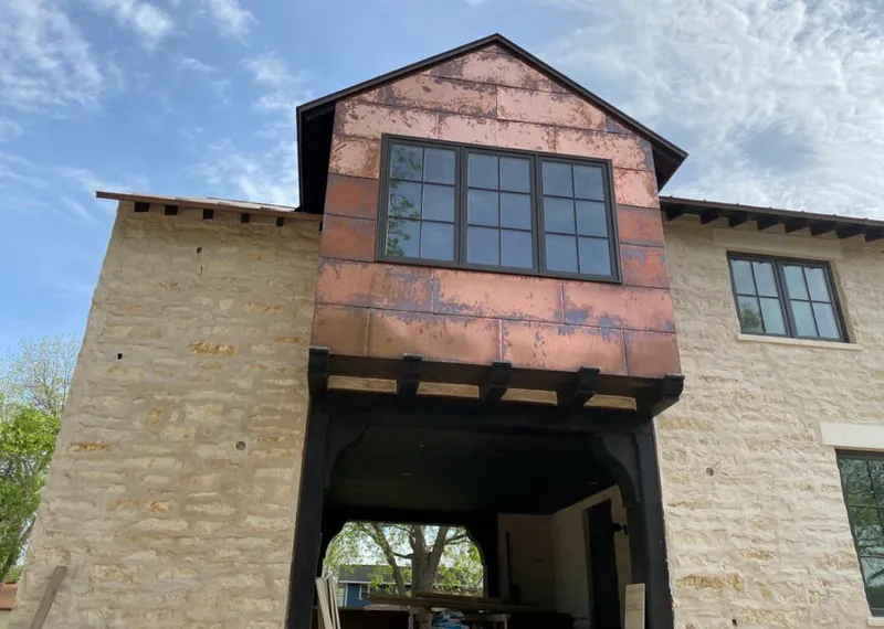 Copper metal panel facade on a stone building for Metal Roof Coating in Lake Arrowhead