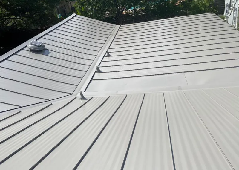 Solar attic fan installed on a metal roof for Roof Ventilation in Lake Arrowhead